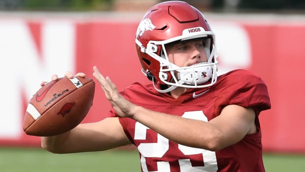 Razorbacks kicker Cam Little throwing the ball during warmups at Sunday morning practice